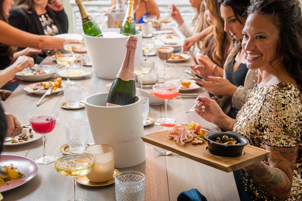 Guests having fun, enjoying food and drinks